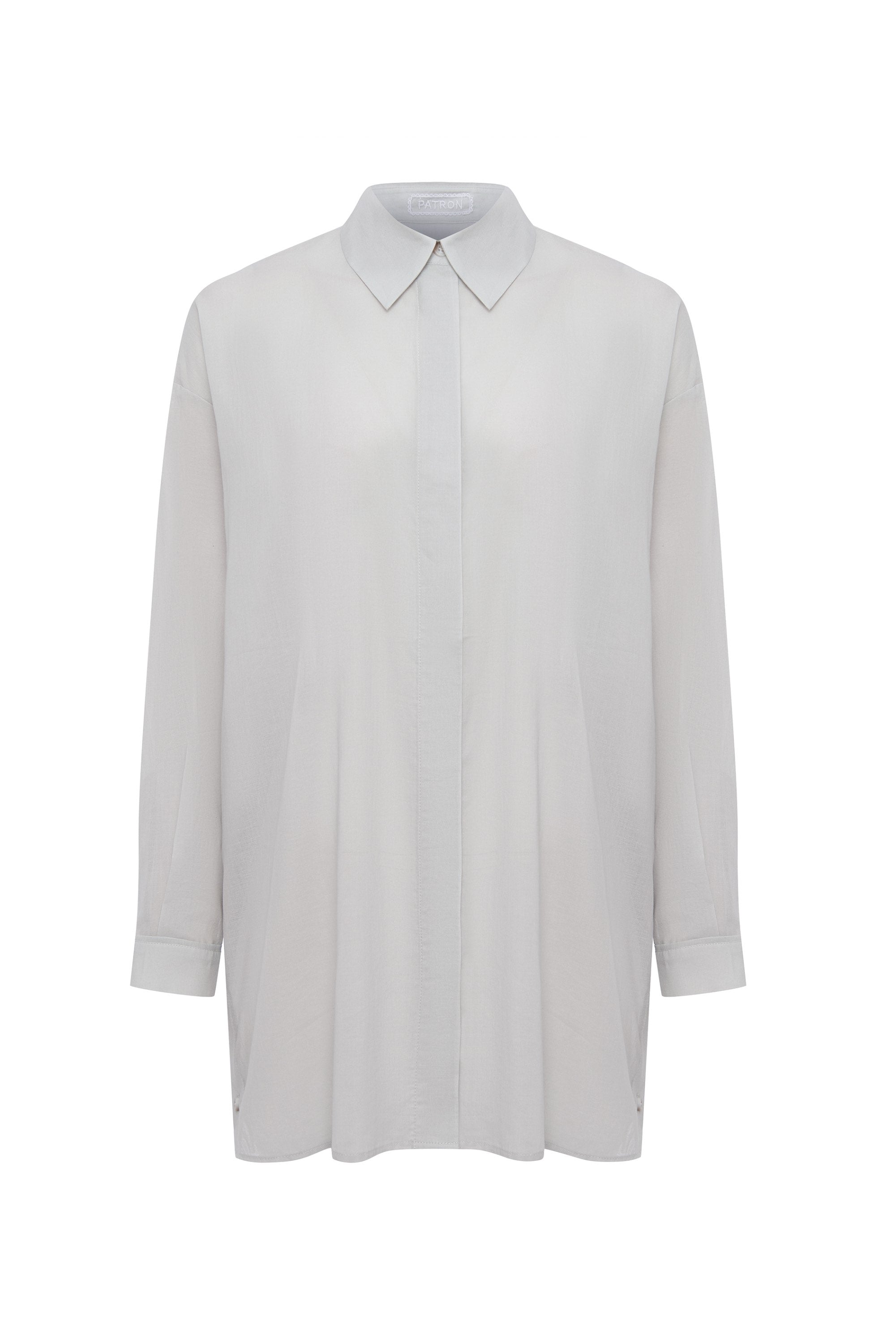 Effortless, fluid, and quietly powerful — the FABIAN shirt is designed for women who value elegance in its most natural form. Its oversized silhouette drapes softly over the body, creating a refined balance between structure and ease.

