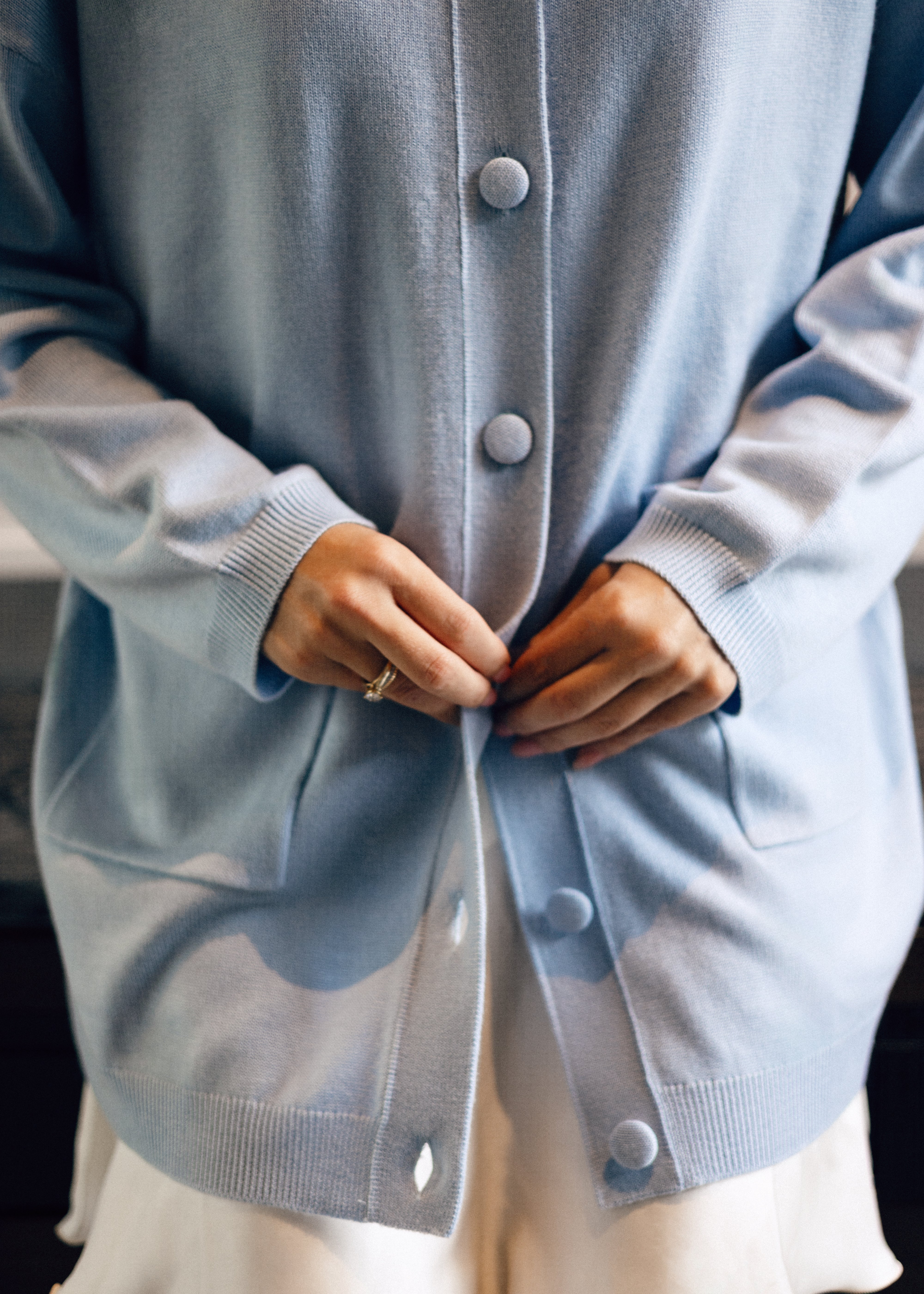 Designed for effortless everyday elegance, the ÉLISE cardigan embodies the quiet luxury of refined simplicity. Its elongated silhouette, soft round neckline, and delicate covered buttons create a graceful balance between comfort and polished femininity. Fast delivery to  Dubai and Singapore 