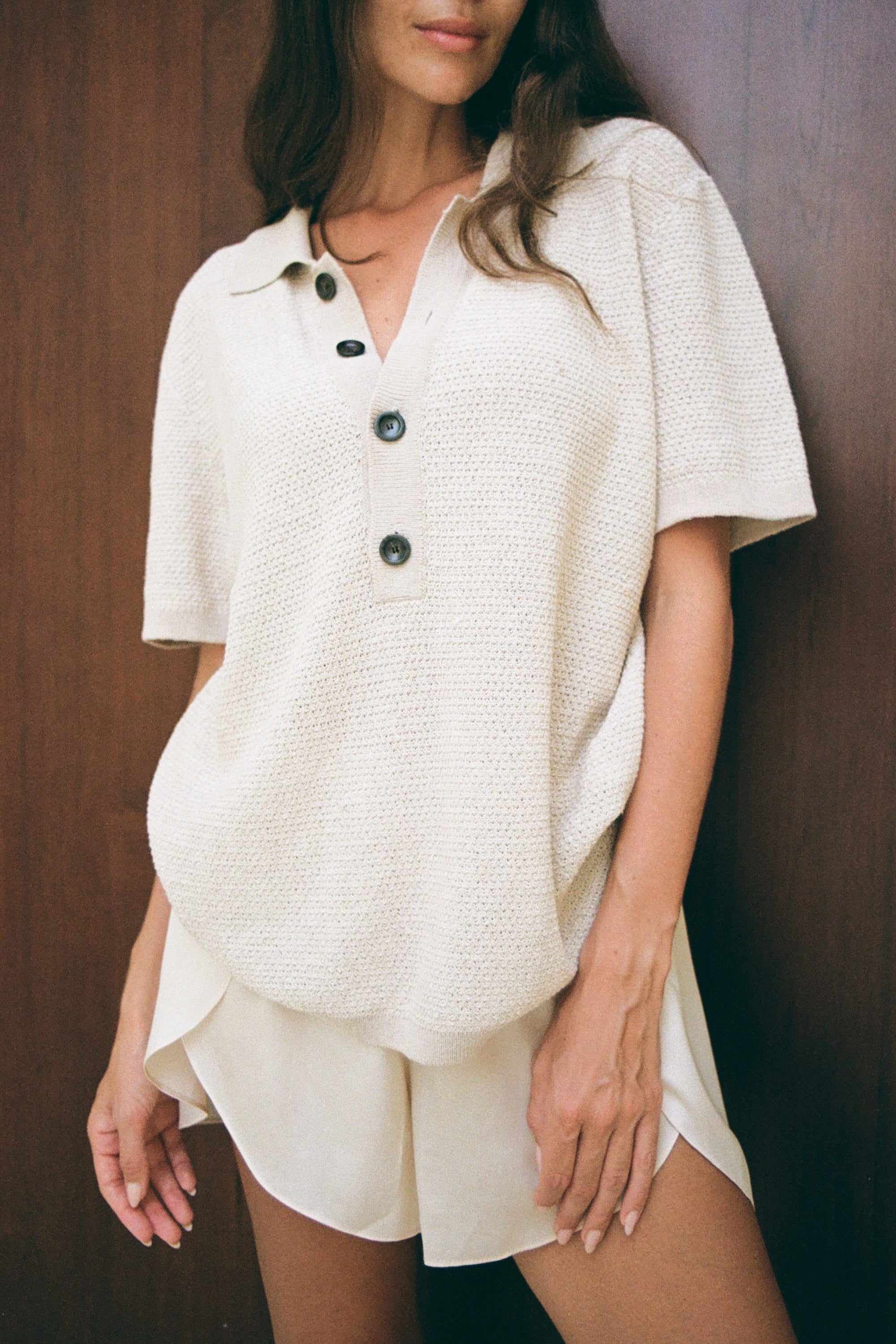 Elegant knitted polo, beige color, modern style. Dubai, London, Singapore, Shanghai .